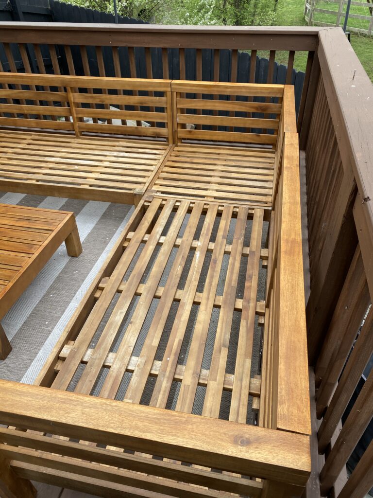 Repaired patio furniture on deck with sanding and stain